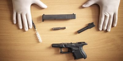 Firearm cleaning and maintenance after use at shooting range.